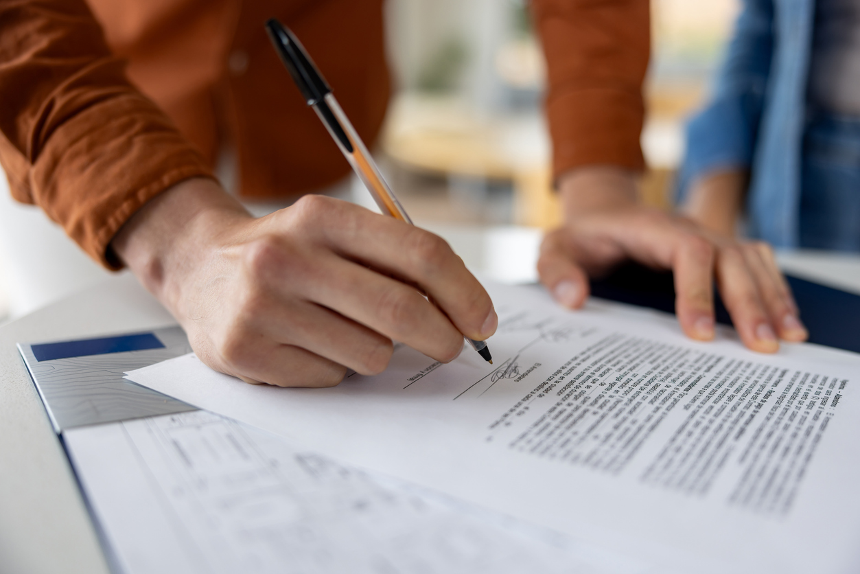 Man signing a document